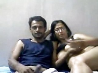 indian grownup pair mr and mrs gupta inside webcam