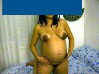 pregnant woman shows off belly